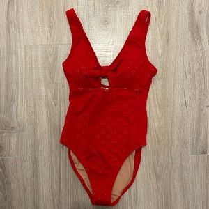 Red one piece with bow and keyhole swimsuit. New with tags, never worn.